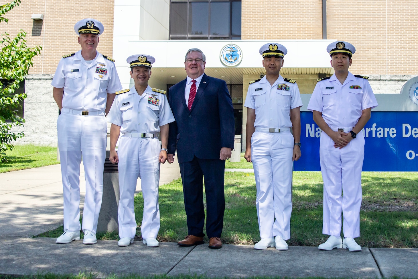 Vice Adm. Takeshi Yoshioka, Commander, Japan Maritime Self-Defense Force's Information Warfare Command, and Mr. Michael Durkin, Director, Navy Warfare Development Center (NWDC), pose for a photo during a visit to NWDC in Norfolk, Virginia. The visit focused on strengthening the U.S.-Japan maritime partnership and enhancing collaboration to address shared challenges.