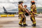 U.S. Air Force Master Sgt. David Denlis, a firefighter with the 121st Air Refueling Wing, and the Lajes Field Fire Department, simulate a motor vehicle accident scenario at Lajes Field, Portugal, on Aug. 10, 2026. The 121st Air Refueling Wing and Lajes firefighters strengthened NATO partnerships by working side by side during duty days, sharing expertise and learning from one another to enhance readiness. Photo by Staff Sgt. Ivy Thomas.