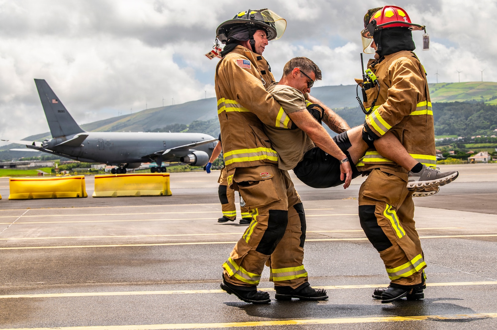 U.S. Air Force Master Sgt. David Denlis, a firefighter with the 121st Air Refueling Wing, and the Lajes Field Fire Department, simulate a motor vehicle accident scenario at Lajes Field, Portugal, on Aug. 10, 2026.