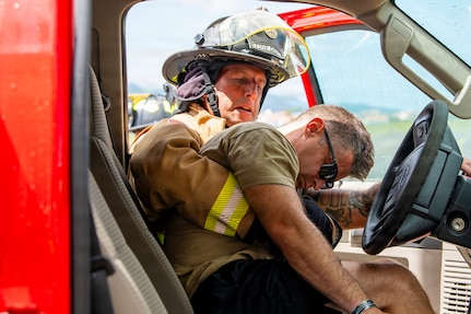 U.S. Air Force Master Sgt. David Denlis, a firefighter with the 121st Air Refueling Wing, works with the Lajes Field Fire Department to simulate a motor vehicle accident scenario at Lajes Field, Portugal, on Aug. 10, 2026.