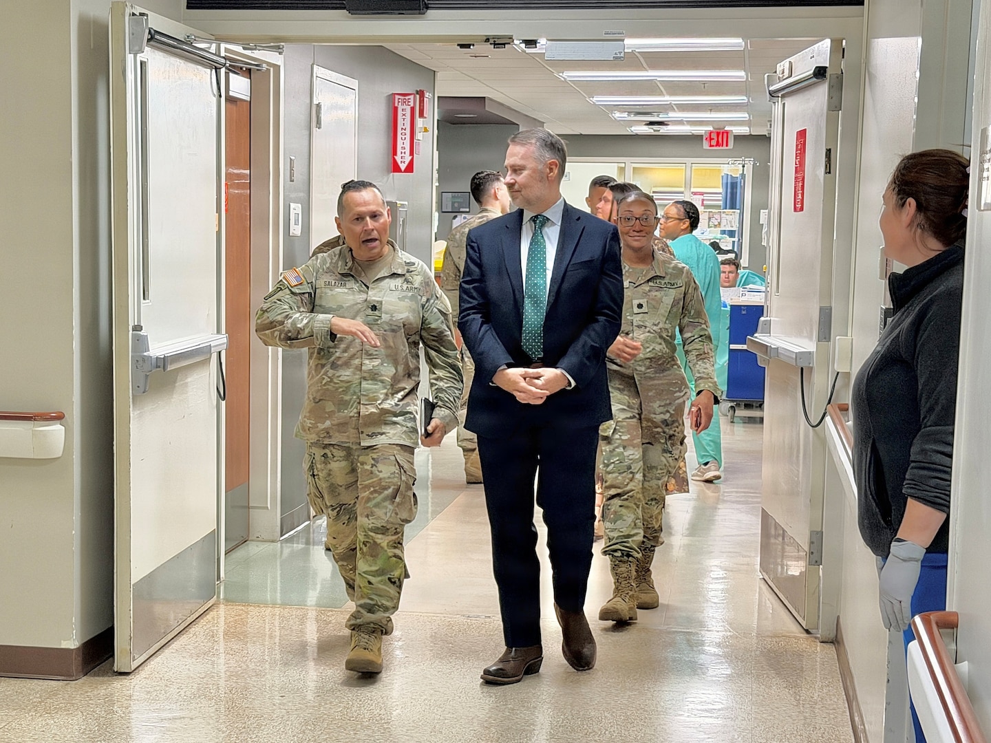A hospital administrator walks with the guest speaker through the halls of BJACH.