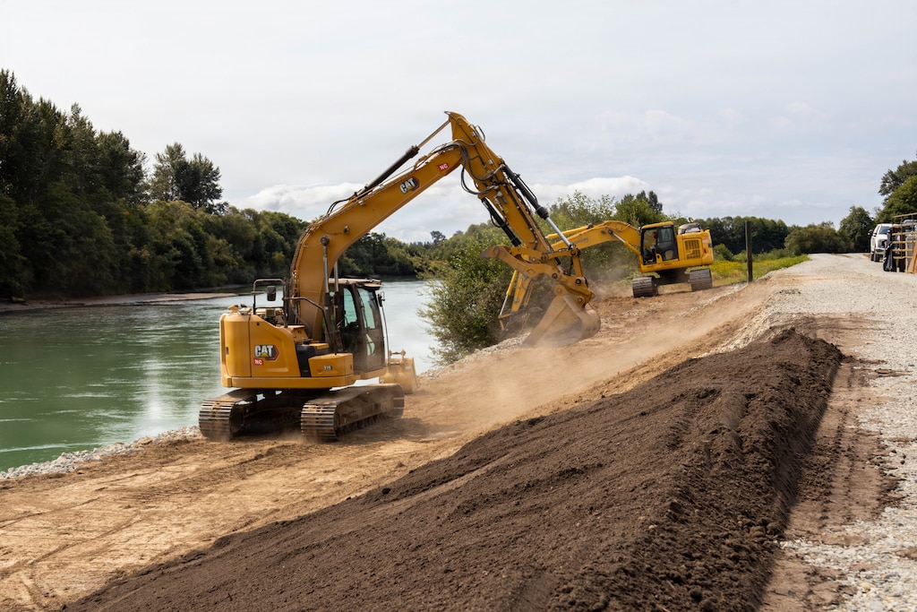 Photo of a bulldozer, moving materials during undergoing levee repair operations at a levee site.
