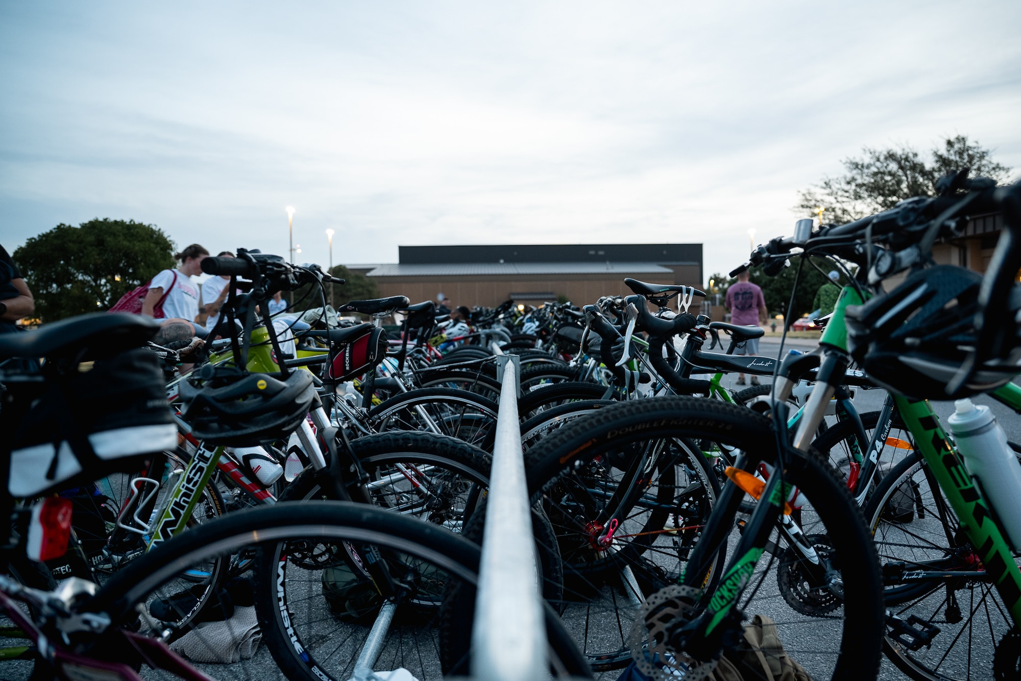 Athletes prepare their bikes before competing in a sprint triathlon at Altus Air Force Base, Oklahoma, Aug. 22, 2026. Hosted by the 97th Force Support Squadron, the event provided an opportunity for members of the Altus AFB community to challenge themselves through physical fitness and friendly competition. (U.S. Air Force photo by Senior Airman Jonah Bliss)