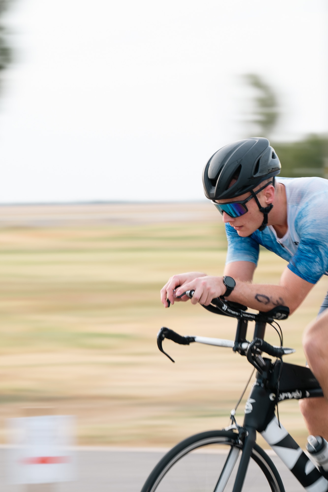 An athlete rides his bike during a sprint triathlon at Altus Air Force Base, Oklahoma, Aug. 22, 2026. The event was part of the 97th Force Support Squadron’s effort to foster a culture of fitness and morale across Altus AFB. (U.S. Air Force photo by Senior Airman Jonah Bliss)