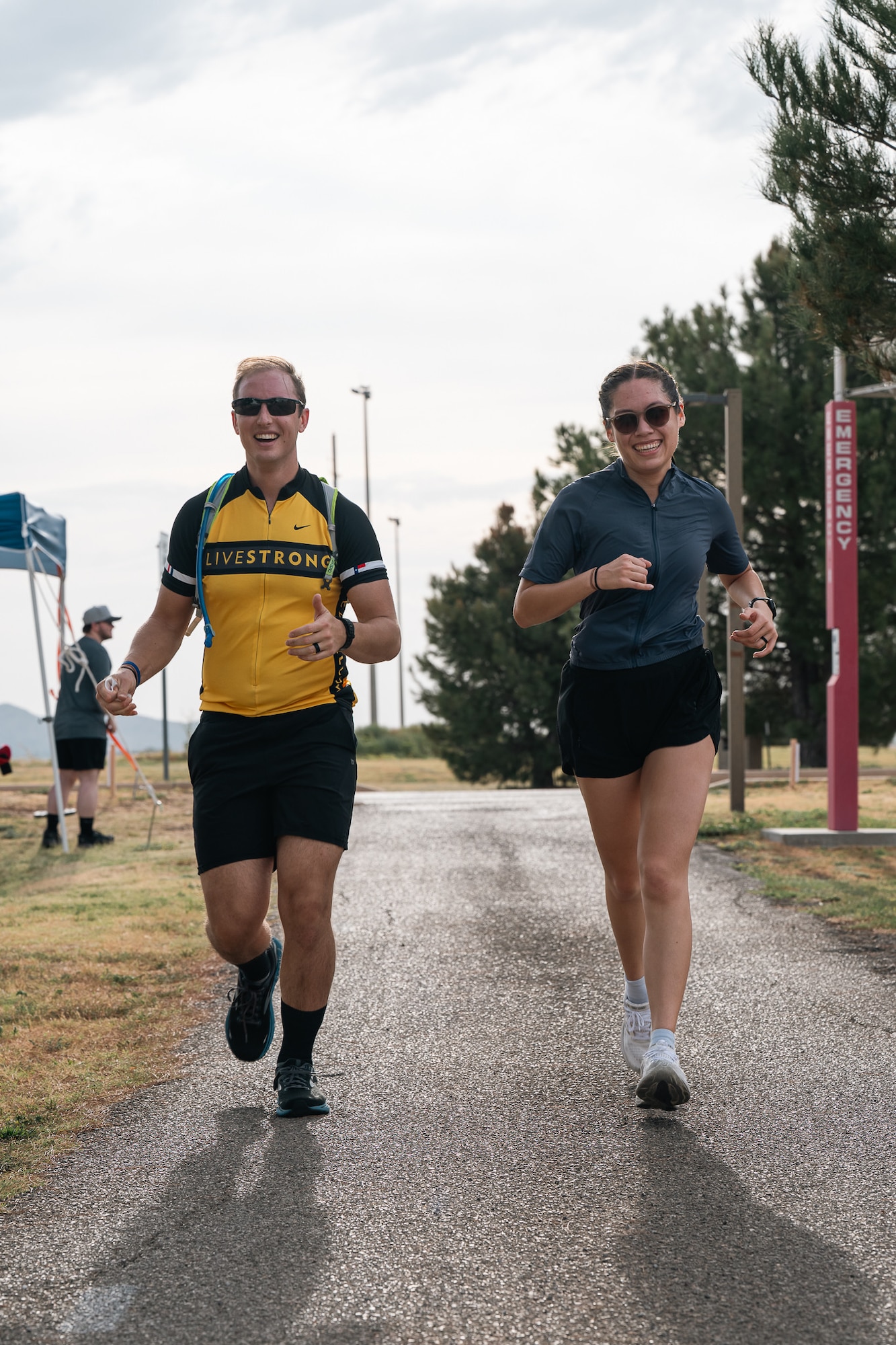 Athletes run during a sprint triathlon at Altus Air Force Base, Oklahoma, Aug. 22, 2026. Competitors completed the final five kilometers of the event after swimming and cycling. (U.S. Air Force photo by Senior Airman Jonah Bliss)