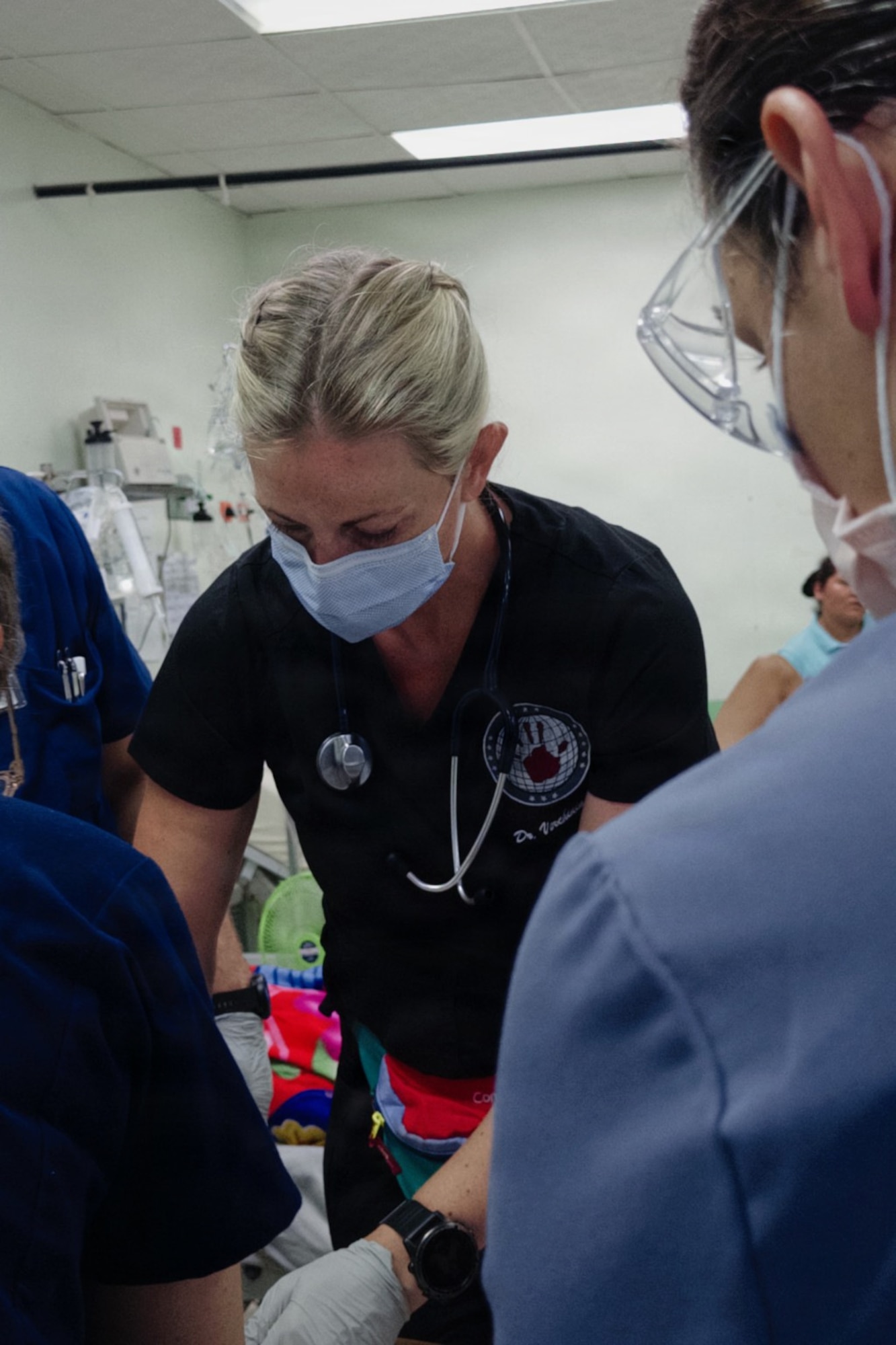U.S. Airmen assigned to the 944th Aeromedical Staging Squadron provide patient care during a Medical Readiness Training Exercise in San Pedro Sula, Honduras. The U.S. Southern Command-sponsored MEDRETE provided Airmen opportunities to apply medical skills in a resource-limited environment while working alongside U.S. and Honduran medical professionals. (Courtesy photo)