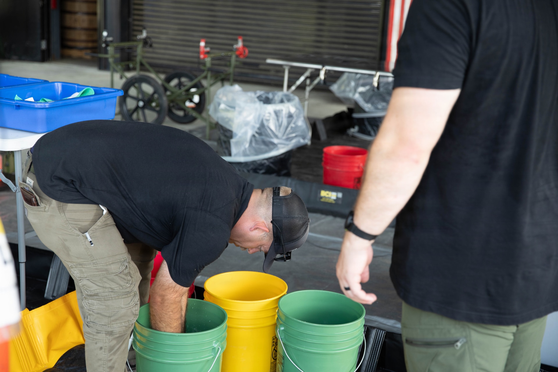 U.S. Army Sgt. 1st Class Christopher Ramsey prepares a decontamination area prior to a training exercise at Jim Beam Distillery Booker Noe Plant in Boston, Kentucky, Aug. 11, 2026.