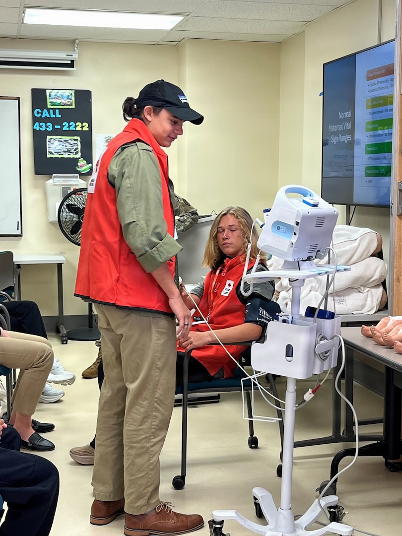 Nikolai Cardona, standing, and James Payne practice taking vital signs during Tripler Army Medical Center’s VolunTEEN program. Created in collaboration with the American Red Cross, the program provides CPR- and HIPAA-certified teens ages 14-17 with hands-on medical experience. From June 1-July 10, participants volunteer six hours each week for a total of 70 hours, rotating through clinics to support staff and develop professional skills.