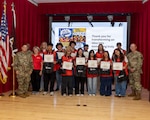 Twelve participants completed Tripler Army Medical Center's VolunTEEN program, a summer program created in collaboration with the American Red Cross. The program provides CPR- and HIPAA-certified teens ages 14-17 with hands-on medical experience. From June 1-July 10, participants volunteer six hours each week for a total of 70 hours, rotating through clinics to support staff and develop professional skills. Picture: (Left); Maj. Erika J. Duarte, U.S. Army Command Sgt. Maj. Omar J Bond, Jackie Wheelen, James Payne, Ignago Zayco, Owen Hornberger, Santiago Saranghilo, Len Green, Kaethe Durnell, Anthony Mancia, Keighley Delosreyes, Catherine O'Connor, Jade Concepcion, Nikokai Cardona and Marcela Deleo, and U.S. Army Col. William F. Bimson, director, Tripler Army Medical Center.