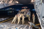 Hawaii Army National Guard Soldiers unload a UH-60M Black Hawk helicopter from a Hawaii Air National Guard C-17 Globemaster III assigned to the 204th Airlift Squadron at Clark Air Base, Philippines, Aug. 1, 2026. The aircraft’s arrival marked the first deployment of a Hawaii Army National Guard Black Hawk to the Philippines, supporting bilateral aviation training under the Hawaii-Philippines State Partnership Program. Photo by Senior Master Sgt. Mysti Bicoy.