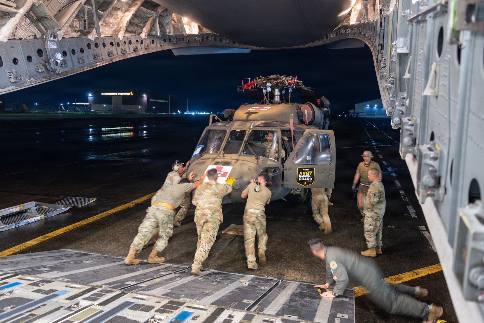 Hawaii Guard Soldiers unload a UH-60 Black Hawk that marked the first deployment of a Hawaii Army National Guard Black Hawk to the Philippines, supporting bilateral aviation training under the Hawaii-Philippines State Partnership Program