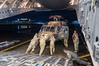 Hawaii Guard Soldiers unload a UH-60 Black Hawk that marked the first deployment of a Hawaii Army National Guard Black Hawk to the Philippines, supporting bilateral aviation training under the Hawaii-Philippines State Partnership Program