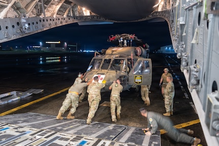 Hawaii Guard Soldiers unload a UH-60 Black Hawk that marked the first deployment of a Hawaii Army National Guard Black Hawk to the Philippines, supporting bilateral aviation training under the Hawaii-Philippines State Partnership Program
