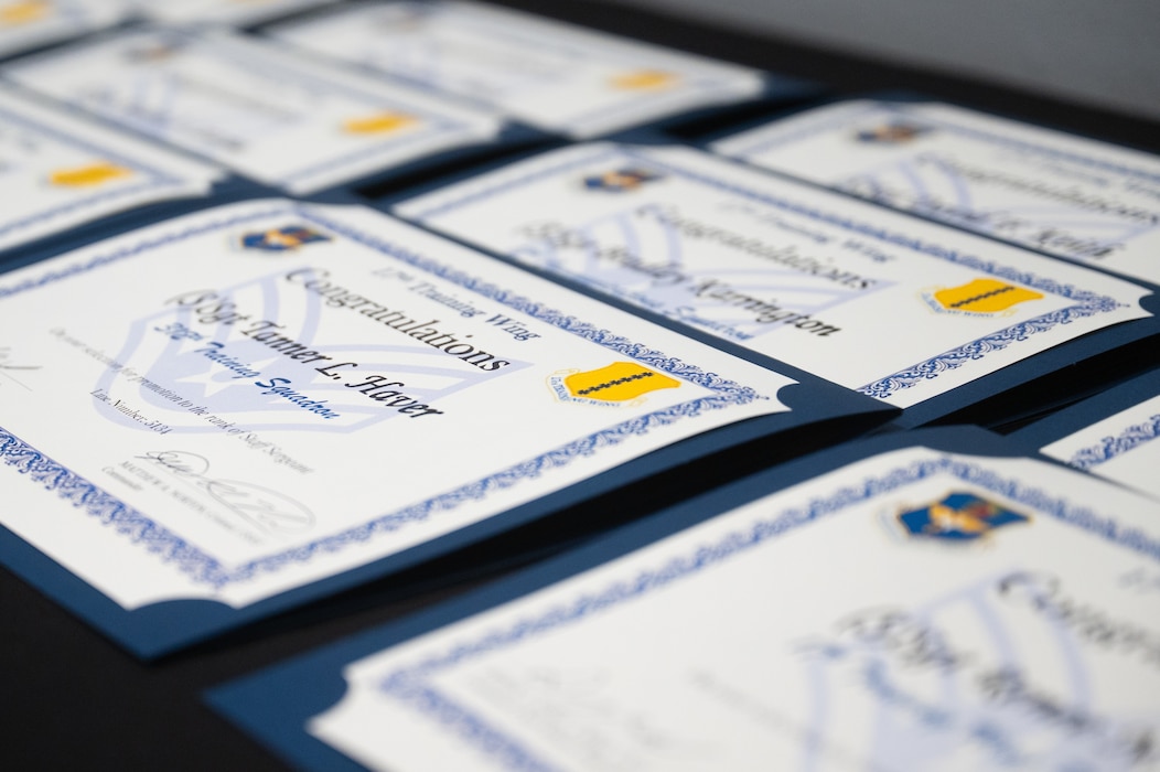 Staff sergeant select certificates are displayed during a staff sergeant release party at Goodfellow Air Force Base, Texas, Aug. 21, 2026. As the Air Force’s first noncommissioned officers grade, staff sergeants serve as frontline supervisors who develop subordinates, ensure mission completion and enforce military standards. (U.S. Air Force photo by Senior Airman Brian Lummus)
