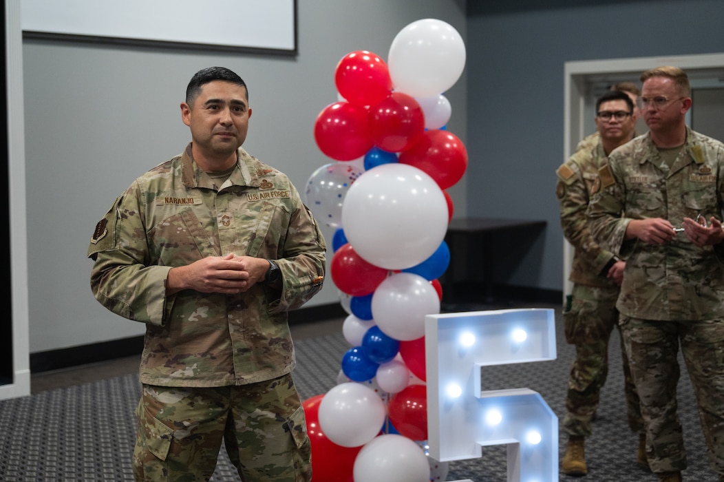 U.S. Air Force Chief Master Sgt. Marcus Naranjo, 17th Training Group senior enlisted leader, congratulates staff sergeant selects during a release party at Goodfellow Air Force Base, Texas, Aug. 21, 2026. Naranjo spoke on the responsibility and importance of being a frontline supervisor. (U.S. Air Force photo by Senior Airman Brian Lummus)