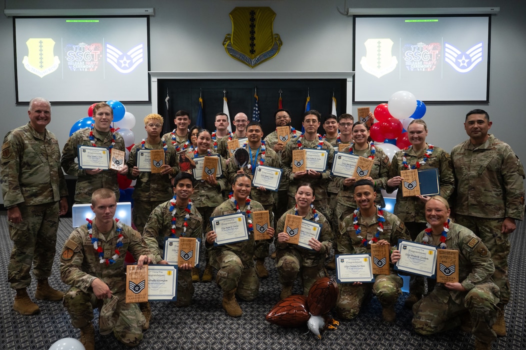 U.S. Air Force senior airmen selected for promotion to staff sergeant pose for a group photo with Col. Matthew Norton, 17th Training Wing commander, and Chief Master Sgt. Marcus Naranjo, 17th Training Group senior enlisted leader, after a staff sergeant release party at Goodfellow Air Force Base, Texas, Aug. 21, 2026. The 17th TRW celebrated 42 of the 12,671 Airmen selected for promotion to staff sergeant during the 26E5 promotion cycle. (U.S. Air Force photo by Senior Airman Brian Lummus)