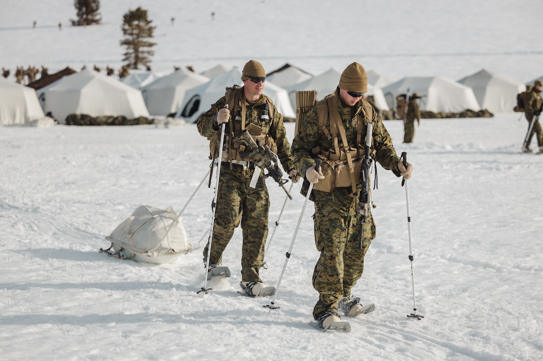 U.S. Marine Corps Sgt. Jarett McMahon, left, a platoon sergeant and 2nd Lt. Nathaniel Schreiner, a platoon commander, both with 1st Battalion, 6th Marine Regiment, 2d Marine Division, conduct a patrol during Mountain Training Exercise 2-25 at Marine Corps Mountain Warfare Training Center, Bridgeport, California, March 1, 2025. MTX 2-25 is designed to prepare units to survive, strengthen expeditionary warfare tactics, and build confidence in their abilities to operate in a cold weather, high-altitude, mountainous environment. (U.S. Marine Corps photo by Lance Cpl. Hunter J. Kuester)
