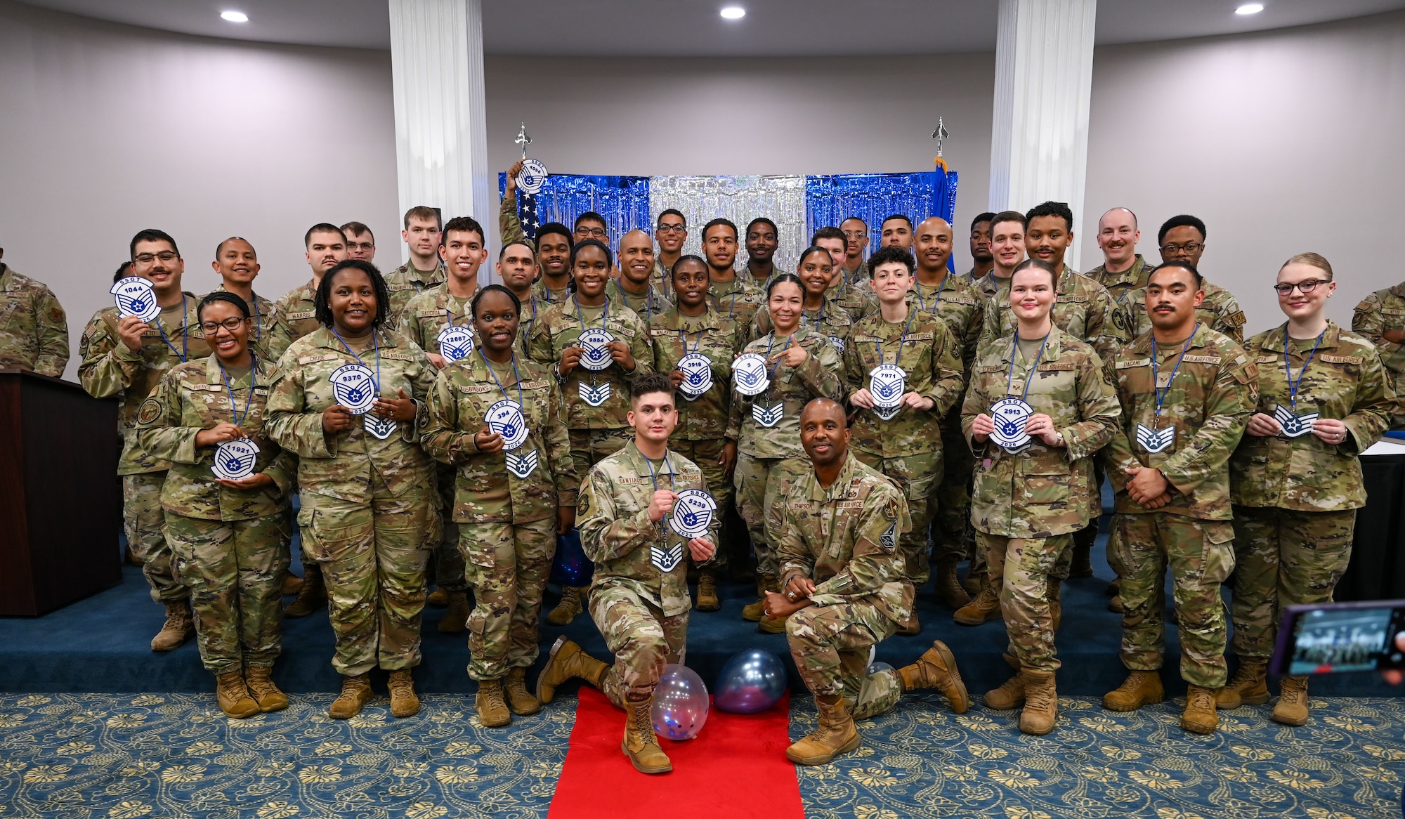 U.S. Air Force Airmen selected for promotion to staff sergeant pose for a photo.