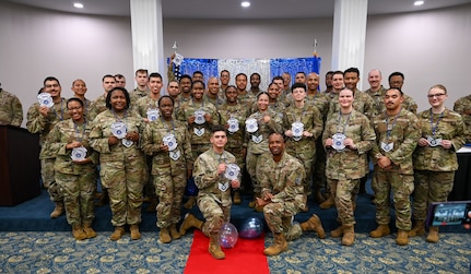U.S. Air Force Airmen selected for promotion to staff sergeant pose for a photo.