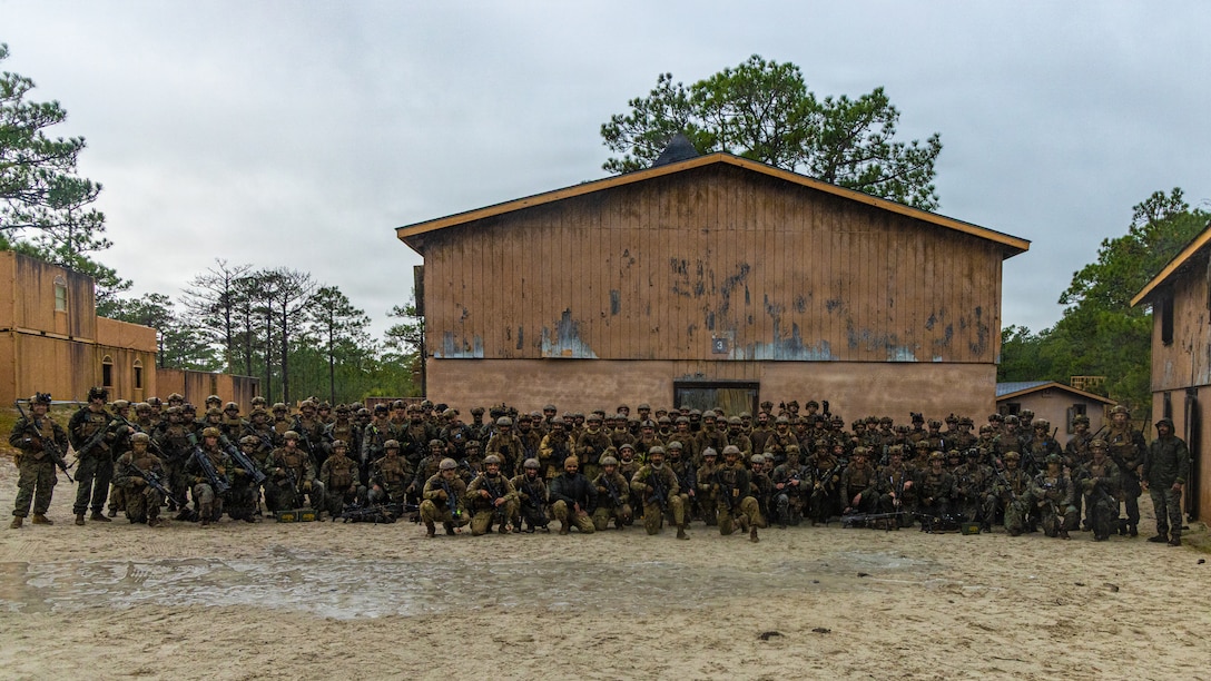 U.S. Marines with Echo Company, 2d Battalion, 6th Marine Regiment, 2d Marine Division, and soldiers with the United Arab Emirates’ Presidential Guard, take a group photo after the final exercise of Unit Enhancement Training 2-25 on Marine Corps Base Camp Lejeune, North Carolina, Oct. 29, 2025.The FINEX consisted of a series of combined arms offensive and counter-insurgency operations at the platoon level, enhancing the proficiency, tactical readiness, and interoperability between the Marine Corps and foreign partners. (U.S. Marine Corps photo by Cpl. Judith Ann Lazaro)