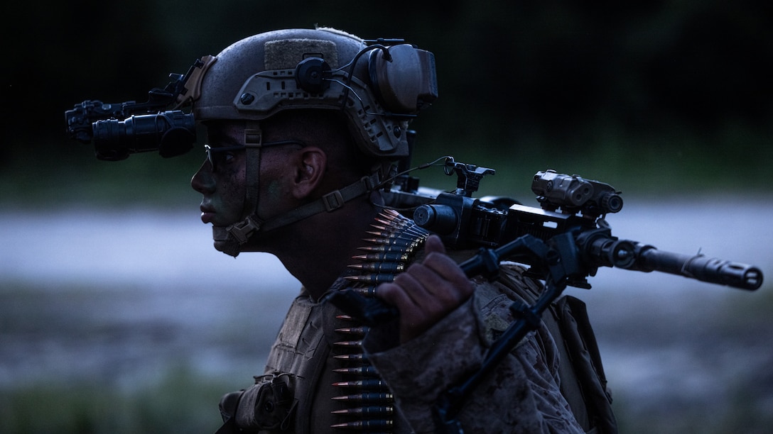 U.S. Marine Corps Lance Cpl. Cameron Robertsepps, a Florida native and infantry machine gunner with 3rd Battalion, 6th Marine Regiment, 2d Marine Division, prepares for a platoon attack range on Camp Lejeune, North Carolina, Aug. 21, 2024. This two week-long exercise promoted a comprehensive warfighting ability and trained the next generation of combat ready forces. (U.S. Marine Corps photo by Lance Cpl. Brian Bolin Jr.)