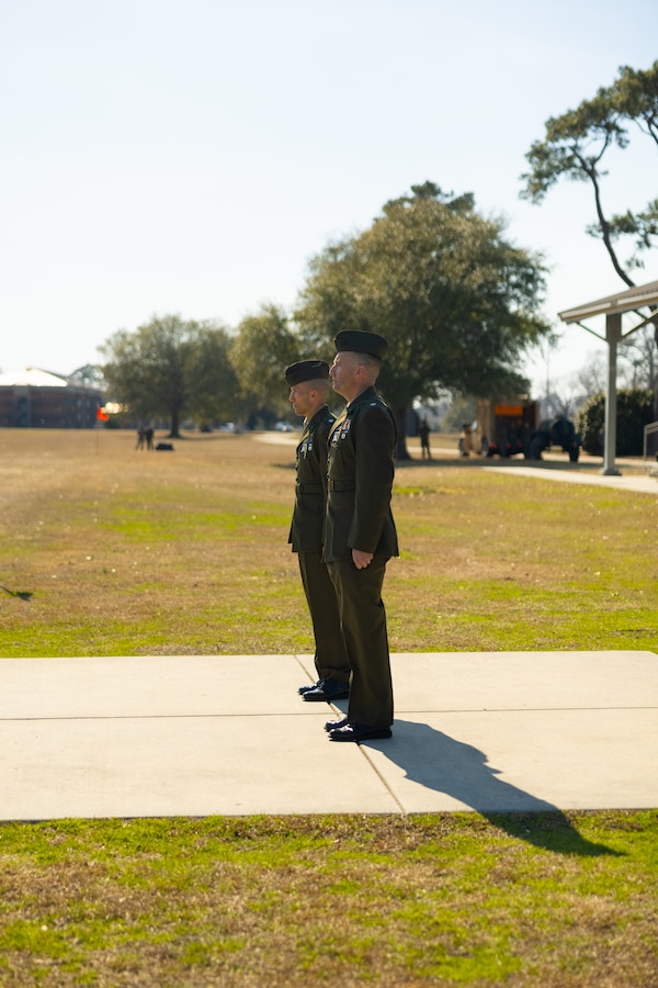 U.S. Marine Corps Lt. Col. William T. Kerrigan (left) the outgoing  battalion commander of 1st Battalion, 8th Marines, 6th Marine Regiment, 2d Marine Division, and Lt. Col. Joseph Fontanetta (right) the oncoming battalion commander of 1st Battalion, 8th Marines, 6th Marine Regiment, 2d Marine Division, stand at attention during a change of command ceremony on Camp on Camp Lejeune, North Carolina, Feb. 24, 2025. During the ceremony, Kerrigan relinquished command to Fontanetta. (U.S. Marine Corps photo by Lance Cpl. Dominic Trujillo)