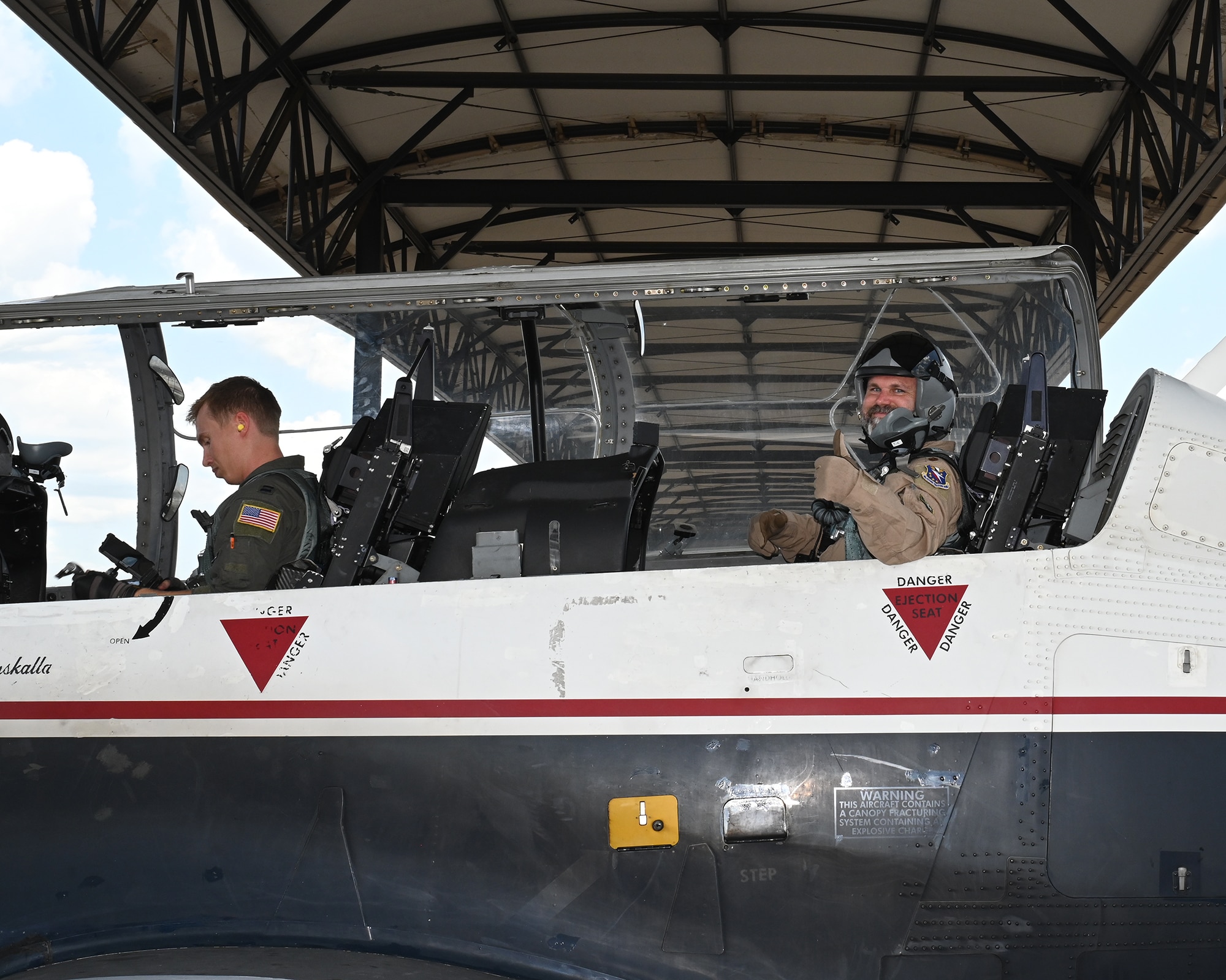 Bryan Farrell, Raspet Flight Research Laboratory Mississippi State Universe, Director, gives a “thumbs-Up” gesture during preflight checks for a T-6 Texan II orientation flight on June 6, 2026, at Columbus Air Force Base, Mississippi. Farrell was part of a new civic outreach and engagement initiative established by the installation commander, Col. James Blech, to immerse community leaders in the daily challenges of student pilots completing pilot training at Columbus AFB. (U.S. photo by Trinity Steinke)