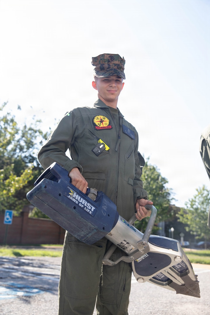 A U.S. Marine with the Chemical Biological Incident Response Force (CBIRF) inventories equipment on a rescue vehicle during the Freedom 250 Grand Prix in Washington, D.C., Aug. 23, 2026. CBIRF enhanced its operational readiness to support contingency operations during the high-visibility event. (DoW photo by Prentice Colter)