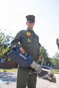 A U.S. Marine with the Chemical Biological Incident Response Force (CBIRF) inventories equipment on a rescue vehicle during the Freedom 250 Grand Prix in Washington, D.C., Aug. 23, 2026. CBIRF enhanced its operational readiness to support contingency operations during the high-visibility event. (DoW photo by Prentice Colter)