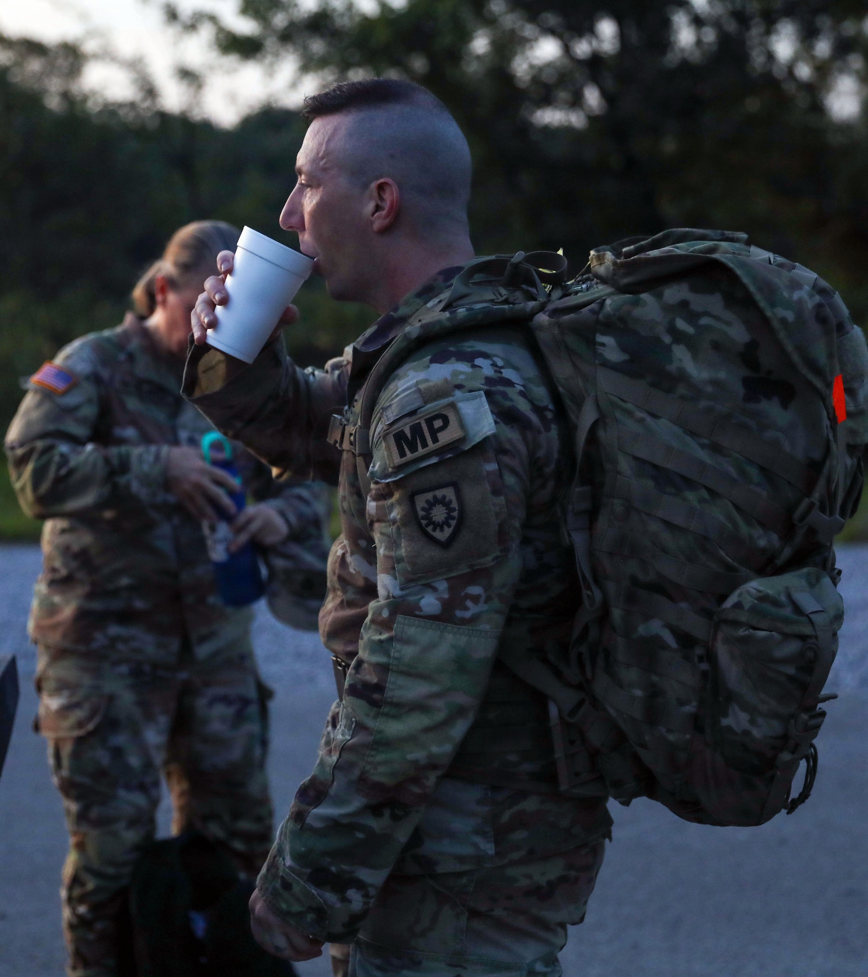 A Soldier drinks water at the halfway point of the 5-mile ruck march that was part of the Kentucky National Guard’s pre-command course at Wendell H. Ford Regional Training Center in Greenville, Kentucky, Aug. 14, 2026.