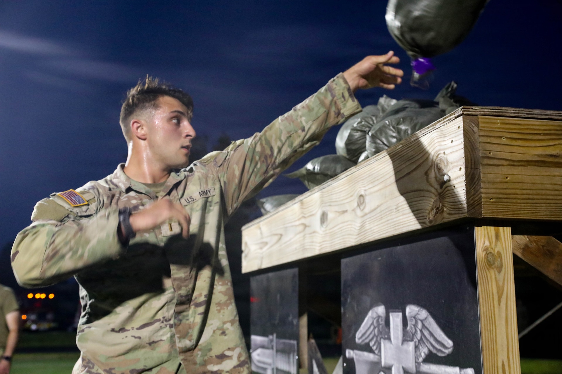 A U.S. Army 2nd Lieutenant throws sandbags during the Combat Field Test (CFT) at the Kentucky National Guard’s pre-command course, held at Wendell H. Ford Regional Training Center in Greenville, Kentucky, Aug. 15, 2026.