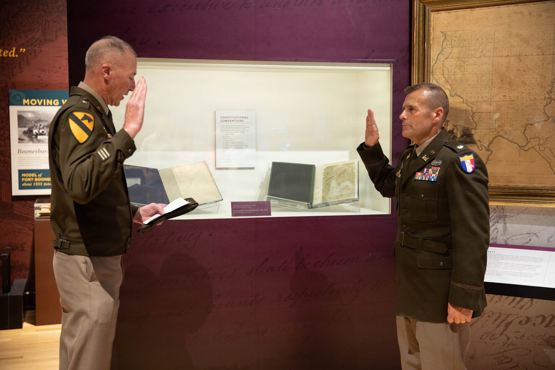 U.S. Army Brig. Gen. Brian Wertzler, Kentucky’s deputy adjutant general, administers the state Oath of Office prior to a promotion ceremony for Lt. Col. John Barger in front of the Kentucky Constitution at the Kentucky Historical Society in Frankfort, Aug. 10.