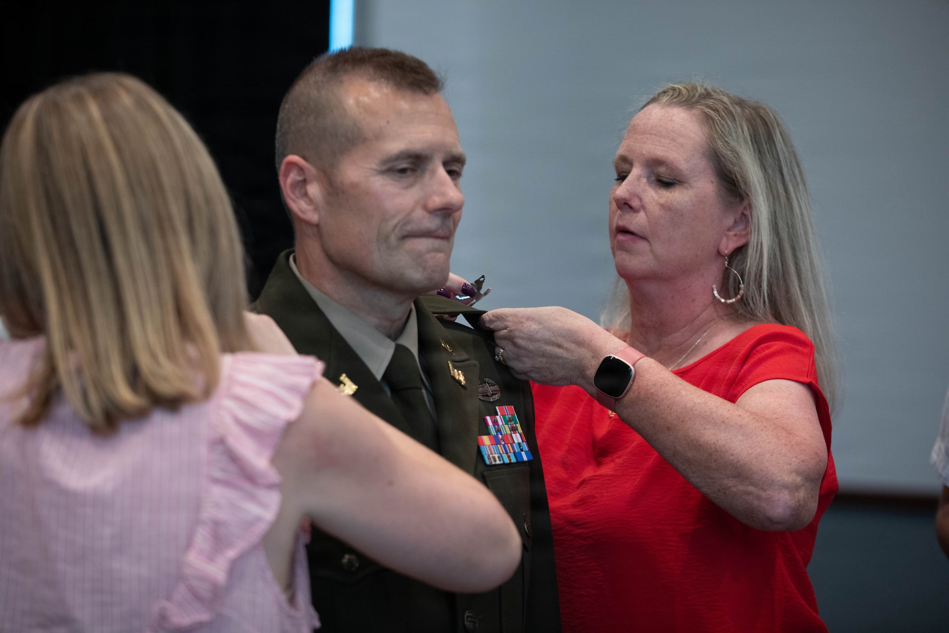 U.S. Army Col. John Barger is pinned with his new rank by his wife, Leannne, and daughter, Sarah Grace, during a promotion ceremony at the Kentucky Historical Society in Frankfort, Kentucky, Aug. 10.