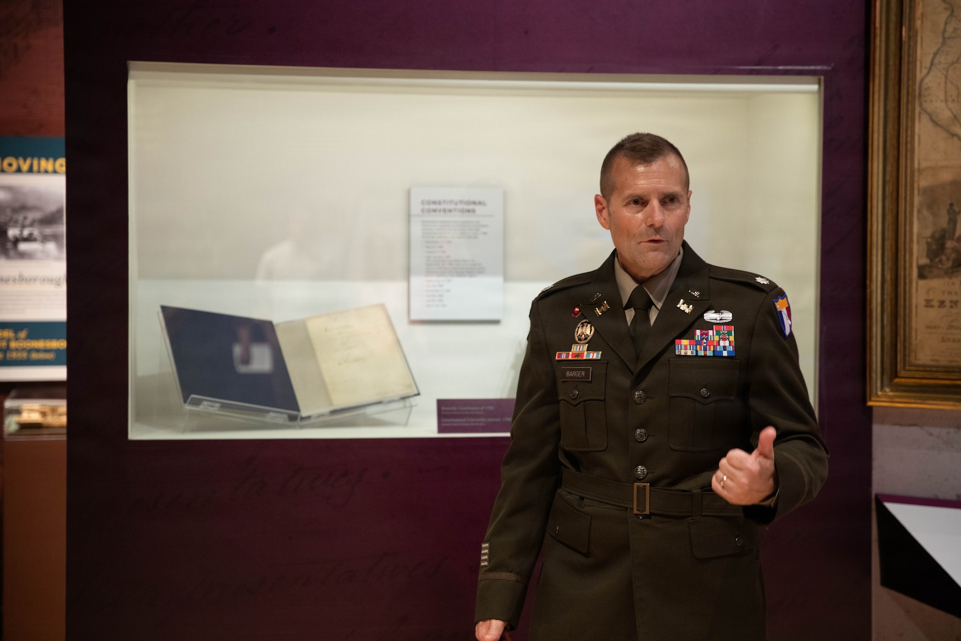 U.S. Army Lt. Col. John Barger speaks in front of the Kentucky Constitution at the Kentucky Historical Society prior to a promotion ceremony in Frankfort, Kentucky, Aug. 10.