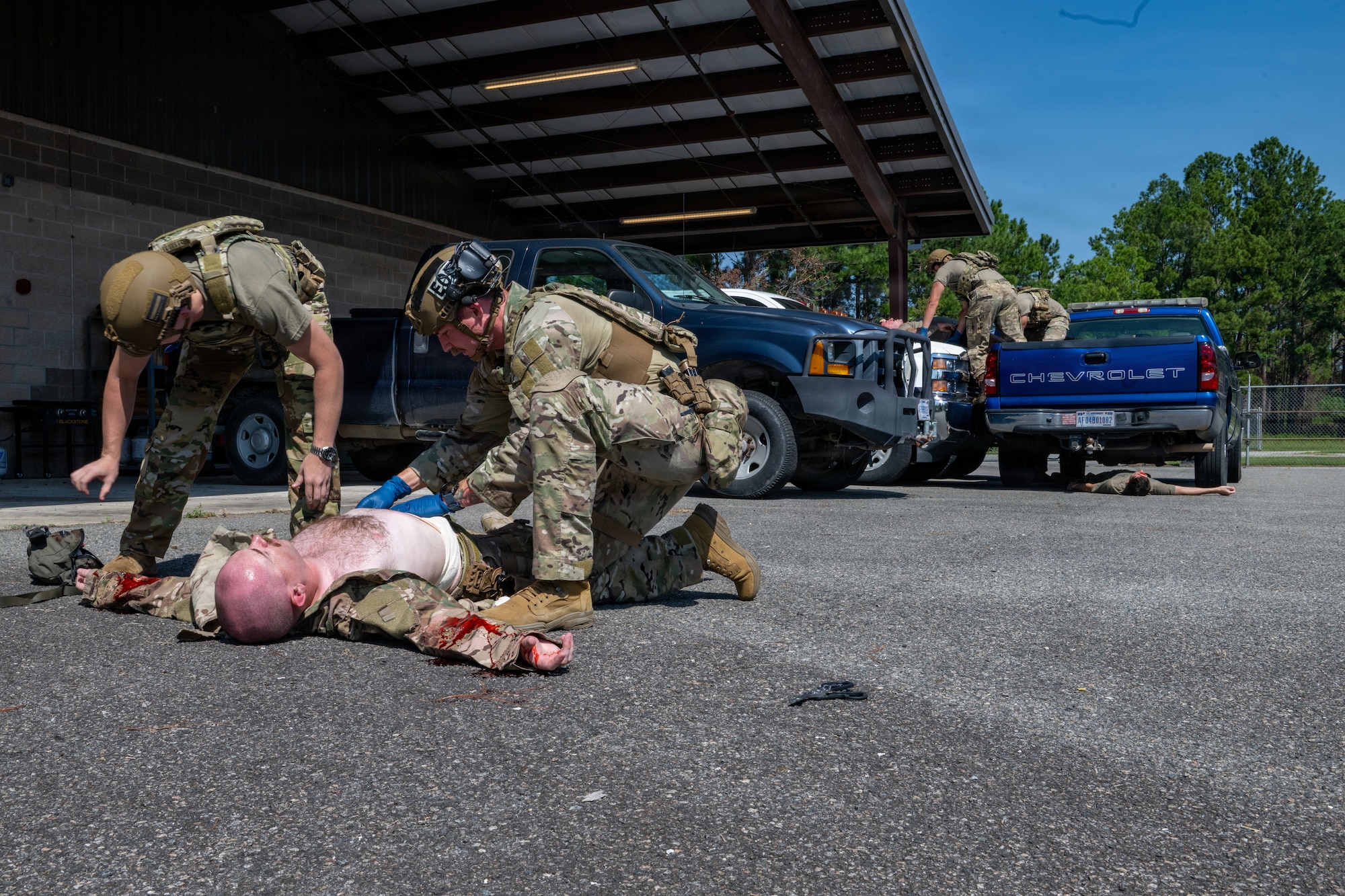 Airman applying TCCC.