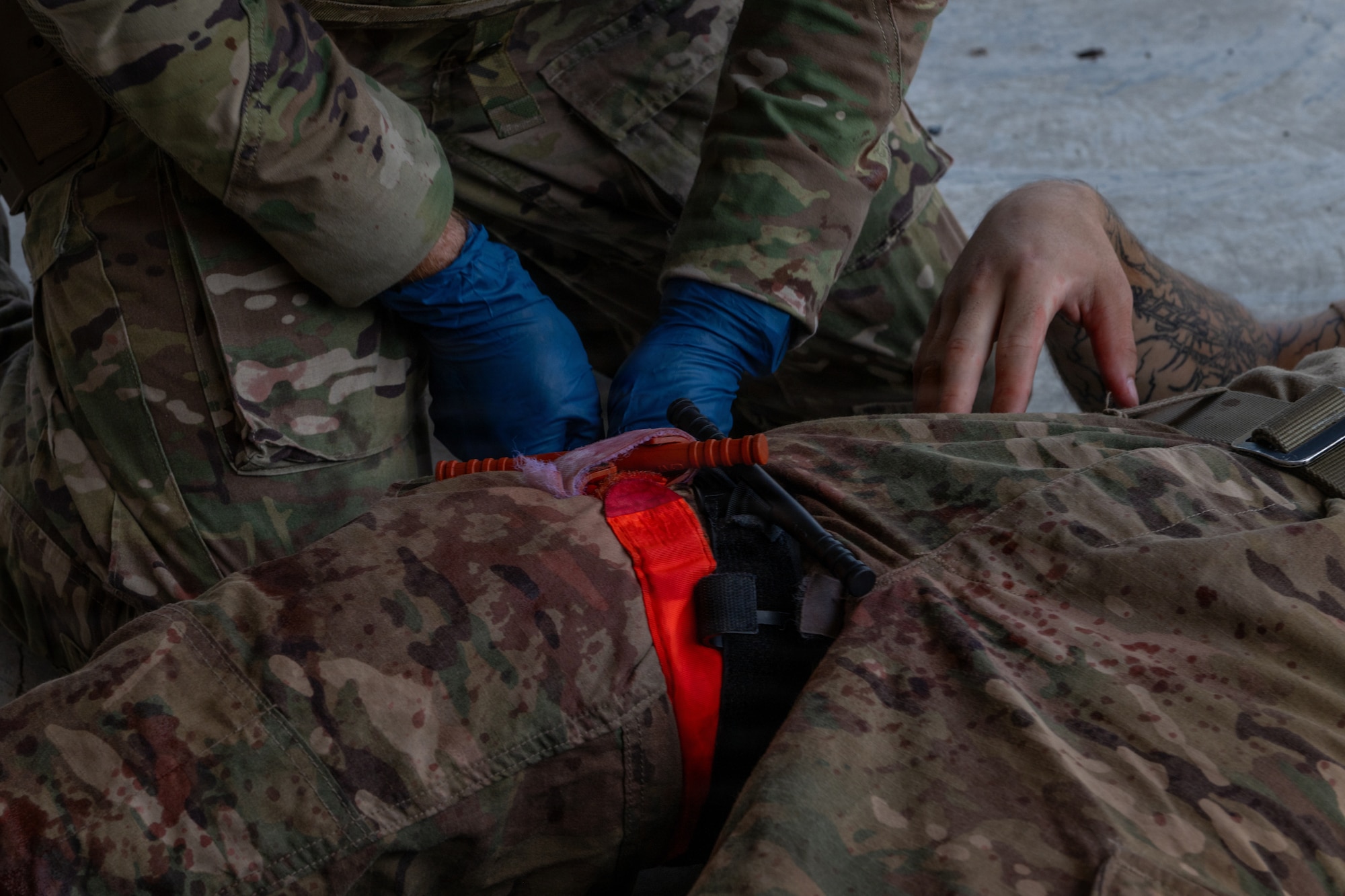 Airman applying TCCC.