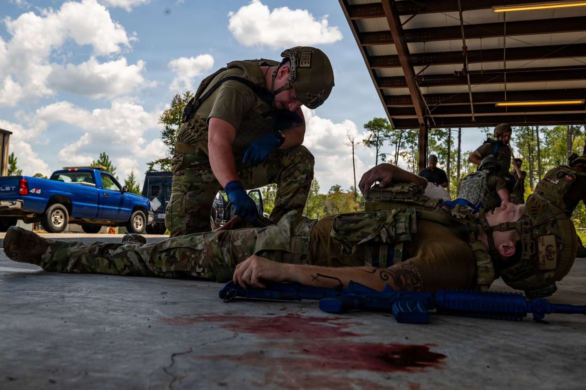 Airman applying TCCC.