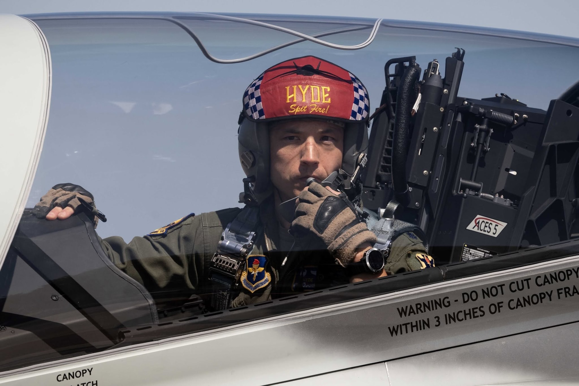 A T-7A Red Hawk pilot surveys the landing zone.