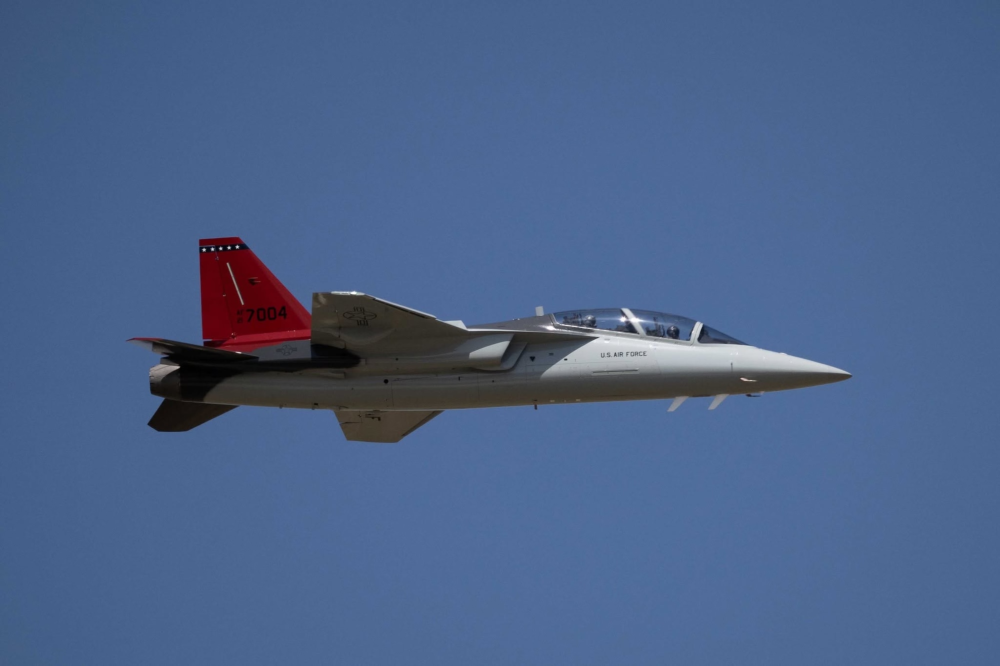 A T-7A Redhawk aircraft flies in the sky
