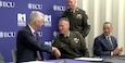Maj. Gen. Matthew Warne, Deputy Commanding General, U.S. Army Reserve Command, and Dr. Phillip Rogers, Chancellor, East Carolina University, signs an Intergovernmental Support Agreement. The agreement will sustain and expand a pioneering predictive maintenance program that has demonstrated measurable benefits in cost savings, mission effectiveness, and long-term infrastructure planning.