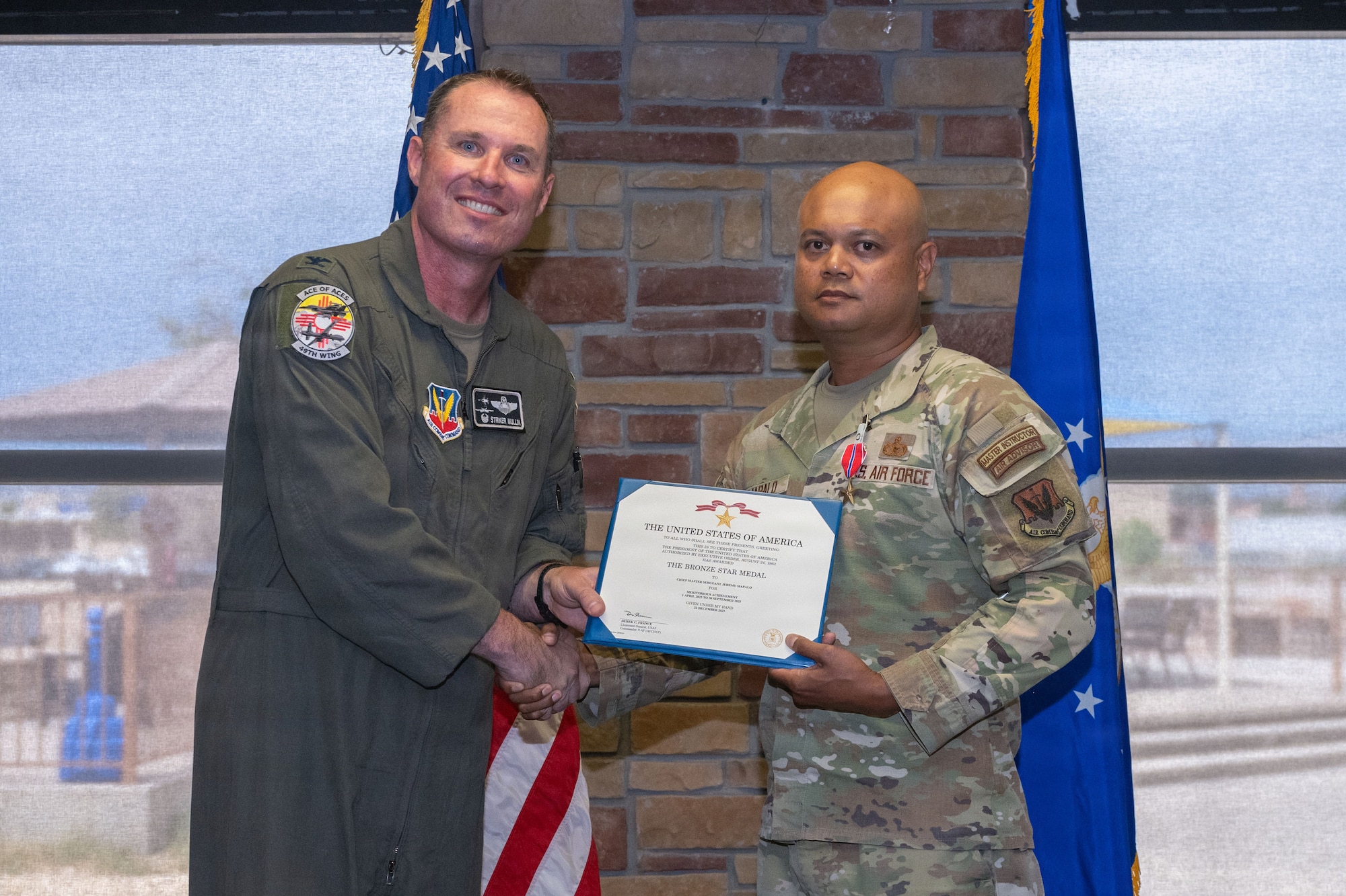 U.S. Air Force Chief Master Sgt. Jeremy Mapalo, 49th Security Forces Squadron senior enlisted leader, receives the Bronze Star Medal during the 49th Wing Security Forces Decoration Ceremony at Holloman Air Force Base, New Mexico, July 10, 2026. While deployed, Mapalo supported operations in the U.S. Central Command area of responsibility. (U.S. Air Force photo by Airman 1st Class Elijah Strickland)