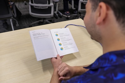 A Defense Logistics Agency Energy employee reviews Franklin Covey during training,