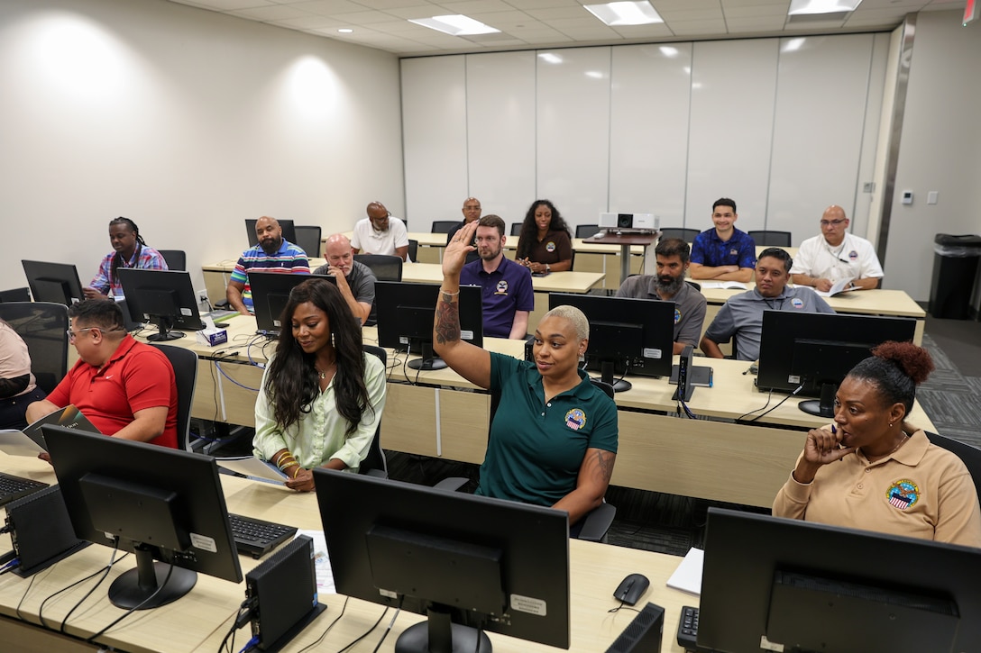 A class of people engage in training.