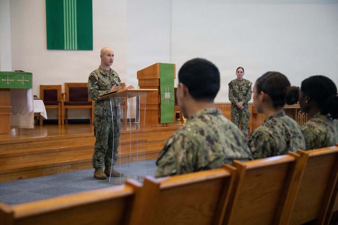 U.S. Navy Hospital Corpsman 2nd Class Shea Buquet, left, assigned to Branch Health Clinic Iwakuni, and a native of Fredericksburg, Virginia, speaks during an emergency medical technician course graduation at MCAS Iwakuni, Japan, Aug. 21, 2026. Organized by Navy Medicine Readiness and Training Unit Iwakuni, the intensive six-week course prepared four Sailors and a Marine to handle everything from routine calls to life-threatening emergencies, qualifying them for a National Registry of Emergency Medical Technicians certification. (U.S. Marine Corps photo by Cpl. Colin Thibault)