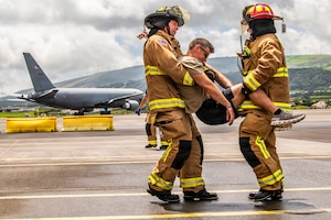 U.S. Air Force Master Sgt. David Denlis, a firefighter with the 121st Air Refueling Wing, and the Lajes Field Fire Department, simulate a motor vehicle accident scenario at Lajes Field, Portugal, on Aug. 10, 2026.