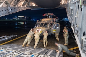 Hawaii Guard Soldiers unload a UH-60 Black Hawk that marked the first deployment of a Hawaii Army National Guard Black Hawk to the Philippines, supporting bilateral aviation training under the Hawaii-Philippines State Partnership Program