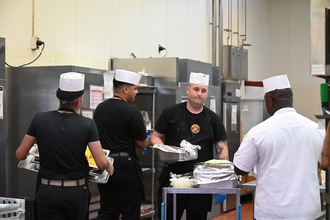 Corporal William Grant, a Combined Arms Training Center, Camp Fuji, food service Marine, in the galley during the Marine Corps Installations Pacific Food Services Specialist of the Quarter competition, August 19, 2026. (U.S. Marine Corps photo by Song Jordan)