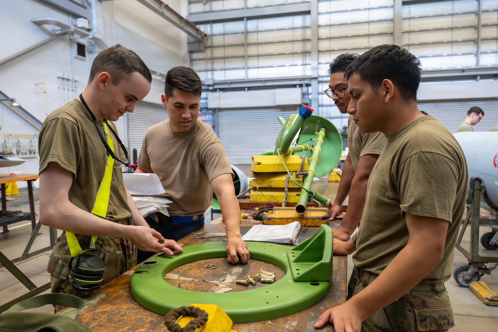 U.S. Air Force Airmen assemble external fuel tank components during Nestable Fuel Tank Build Up (NFTBU) training at Misawa Air Base, Japan, Aug. 26, 2026. The five-day training prepares Airmen outside the Fuel Systems specialty to augment fuel tank production during increased demand, expanding the 35th Fighter Wing’s capacity to sustain combat airpower and meet operational demands across the Pacific. (U.S. Air Force photo by Airman 1st Class Angelica Winther)