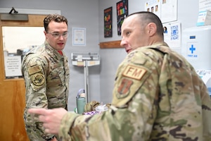 Capt. Mark Boyle, a 104th Fighter Wing comptroller, checks in with Master Sgt. Jeremy Knowles, a 104th Fighter Wing finance noncommissioned officer, for the body composition program at Barnes Air National Guard Base, Westfield, Mass., Aug. 21, 2026.