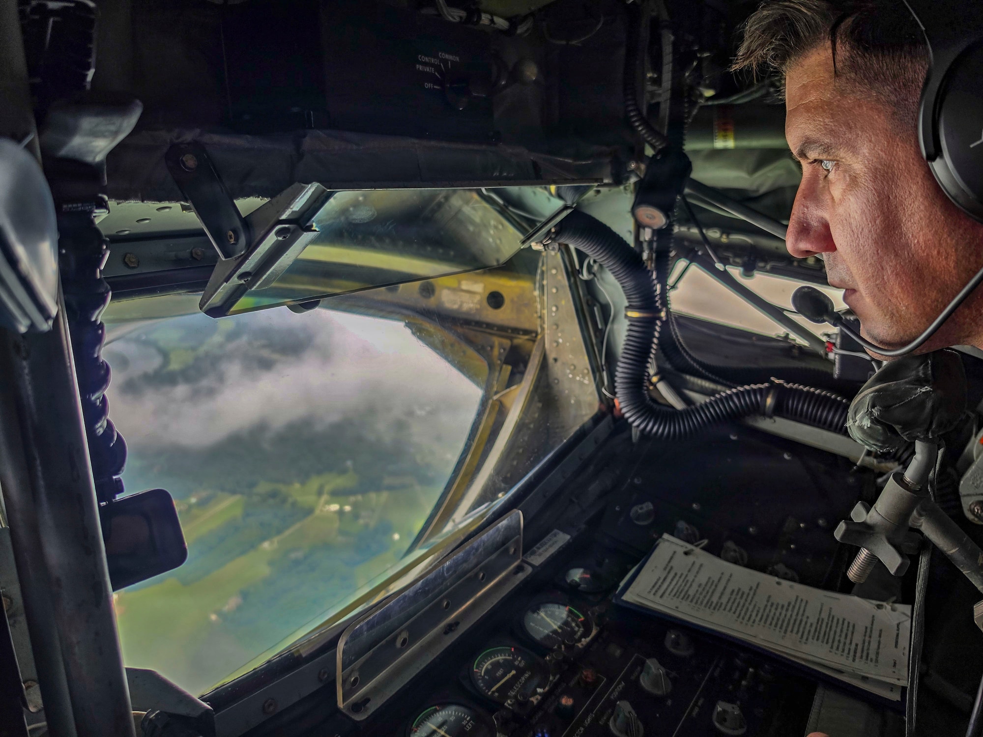 U.S. Air Force Master Sgt. Nathaniel Scheffel, 91st Air Refueling Squadron boom operator, prepares to lower the boom during a flyover above Arlington National Cemetery, Virginia, Aug. 20, 2026. The flyover honored the life and service of retired U.S. Air Force Col. Jesse C. Bush Jr., a World War II veteran and last living survivor of the Berlin Airlift. (U.S. Air Force photo by Senior Airman Monique Stober)